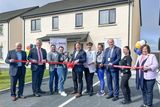 thumbnail: Minister Darragh O’Brien officially launching 67 new homes in Castleisland with CEO Focus Ireland, Pat Deenigan, Pearse O'Shiel, Chairperson, Co-operative Housing Ireland, new houseowners, Adran, Andree and their son Damian Berci, Minister Norma Foley, Lauren Treanor, Cathaoirleach Kerry County Council, Cllr. Jim Finnucane, Lauren Treanor, Ivana Karaivanova, Chief Executive Kerry County Council, Moira Murrell. Photo by Valerie O'Sullivan.
