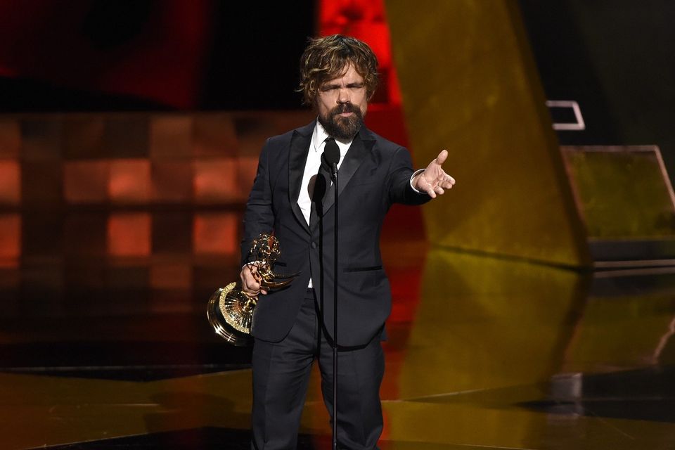 Peter Dinklage accepts the award for outstanding supporting actor in a drama series for Game Of Thrones (AP)