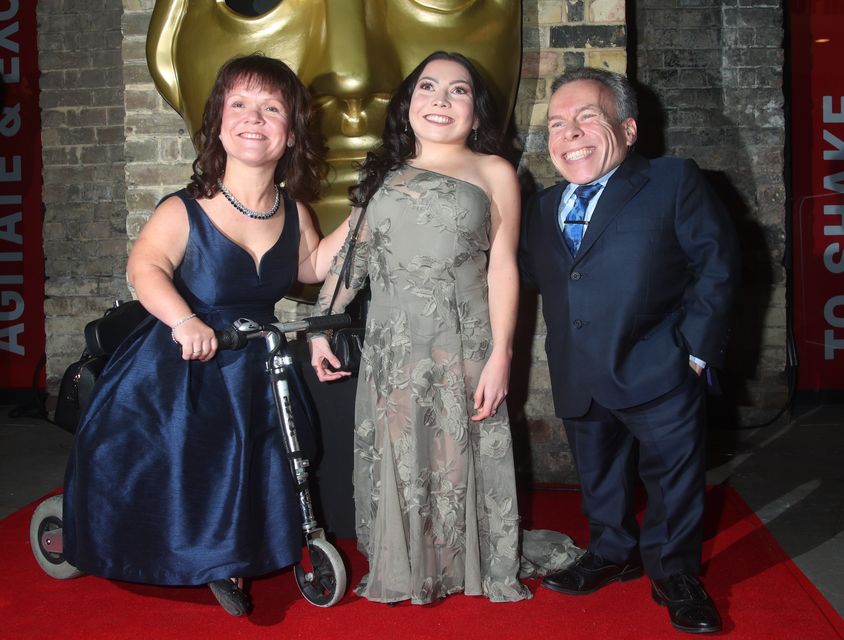 Warwick Davis with wife Samantha, and daughter Annabelle (Yui Mok/PA)