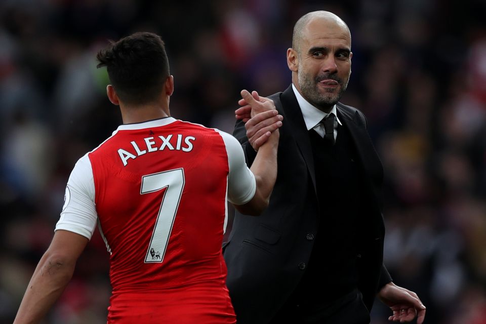 Manchester City manager Pep Guardiola (right) wanted to sign Arsenal's Alexis Sanchez