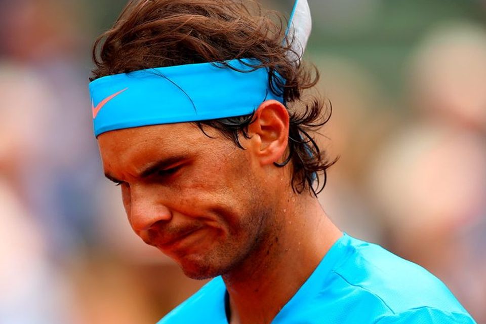 Rafael Nadal of Spain reflects during  his Men's Singles match against Quentin Halys of France on day three of the 2015 French Open at Roland Garros