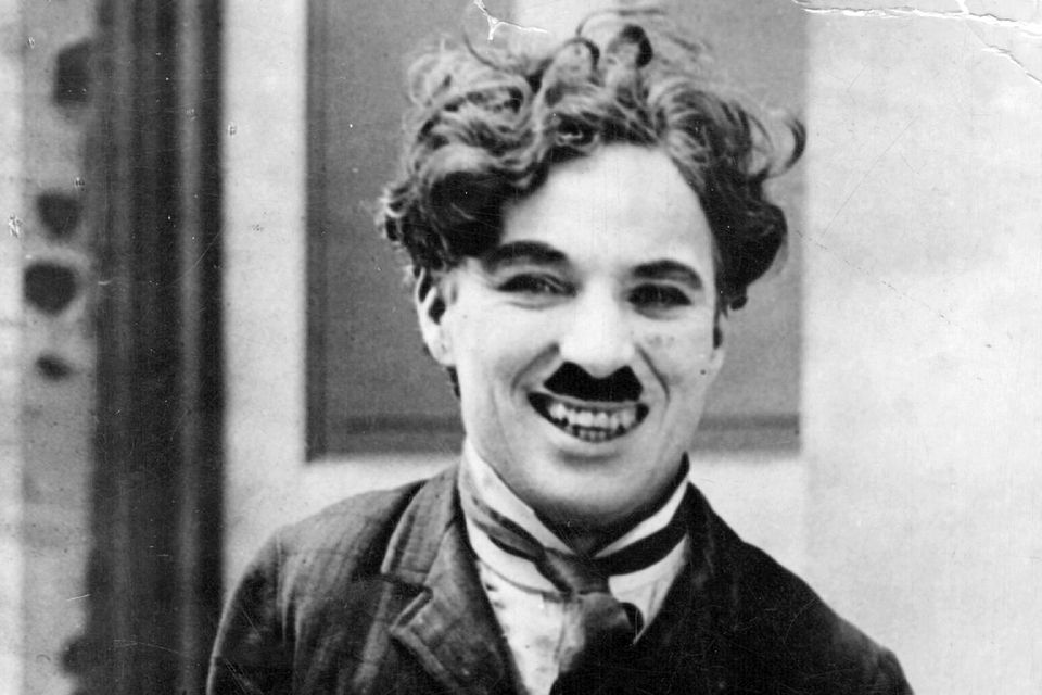 Charlie Chaplin on the set of 1917 silent film Easy Street