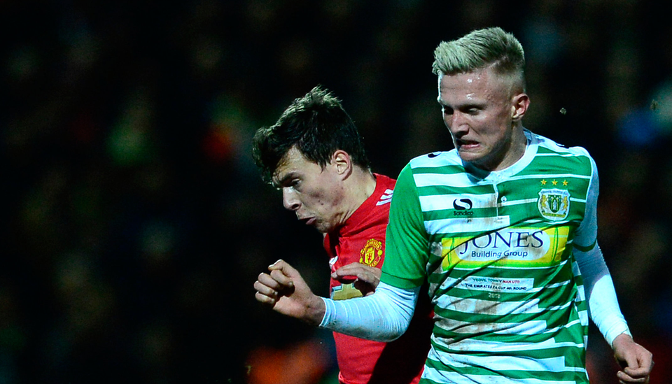 Manchester United's Victor Lindelof tussles with Yeovil Town's Sam Surridge. Photo: Getty Images