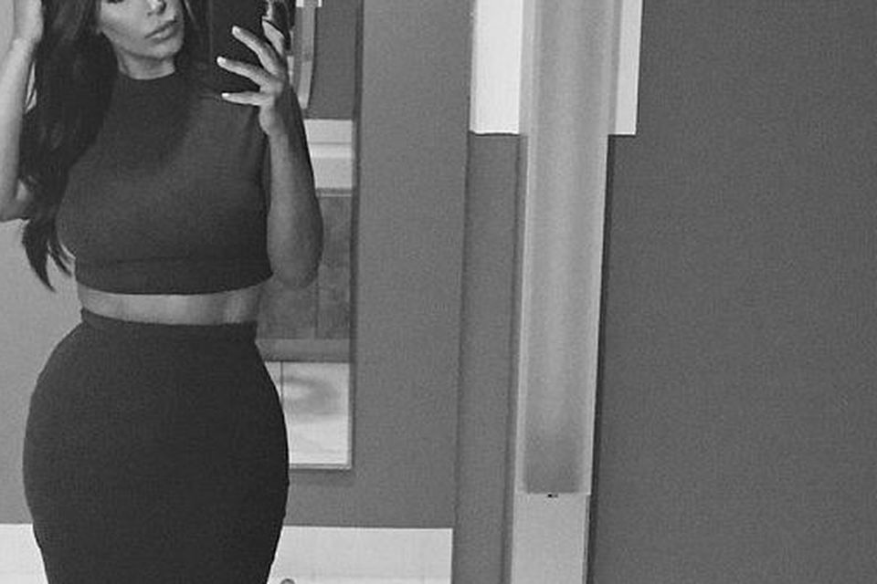 Kim Kardashian almost slips out of leather bikini top as she