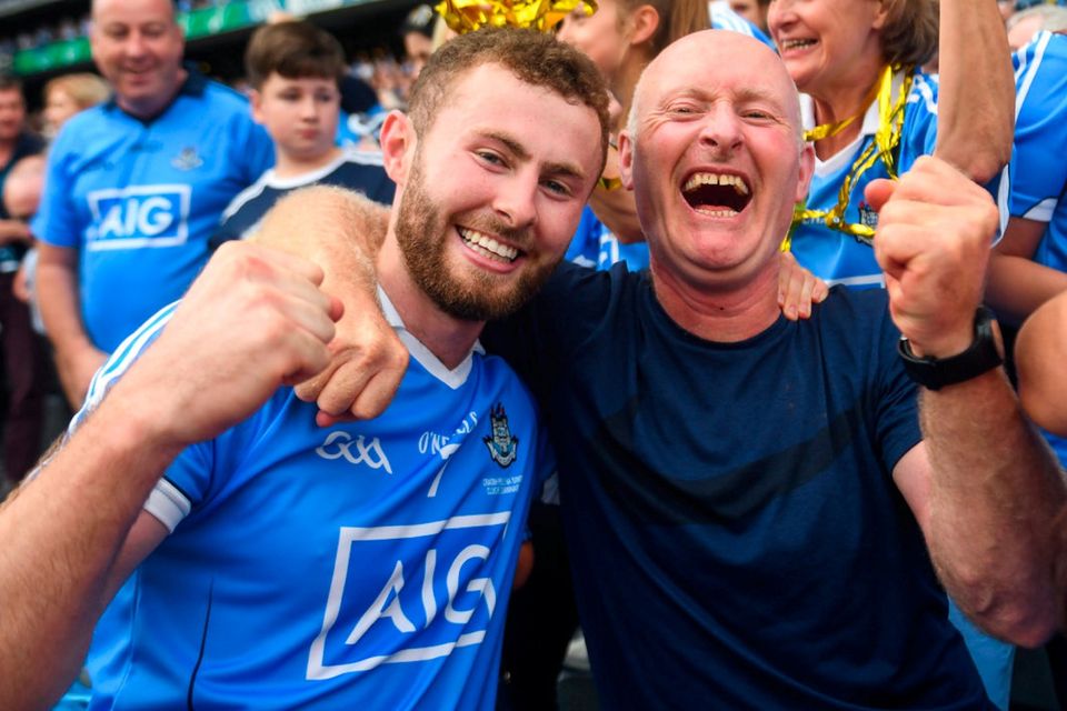 Jack McCaffrey celebrates with his father Noel following Dublin's All-Ireland victory. Photo: David Fitzgerald/Sportsfile