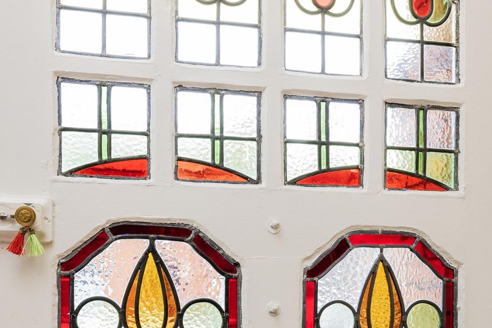 Stained-glass windows in the front doorway
