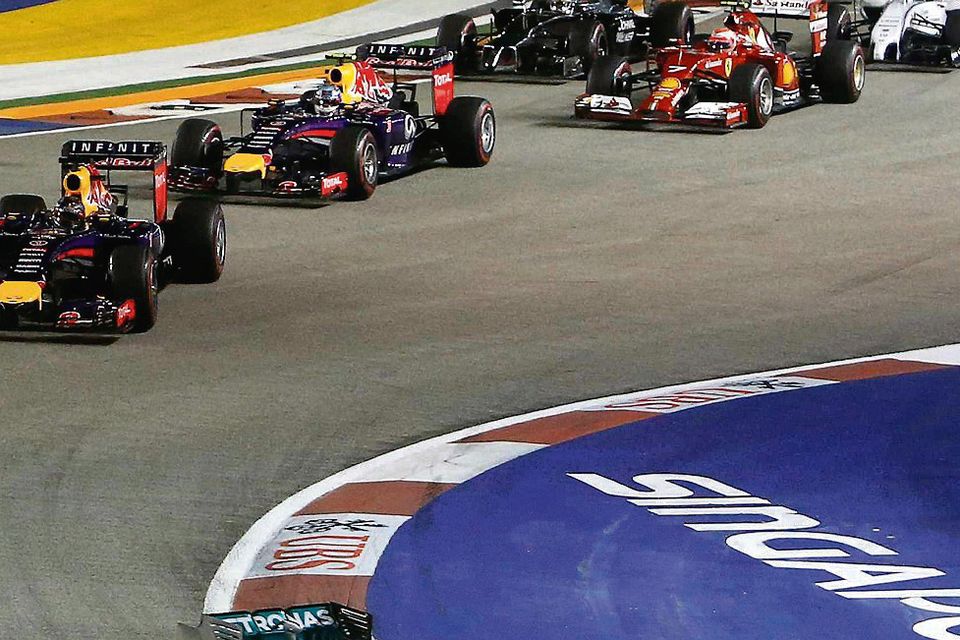 Lewis Hamilton leads the field into the first bend at the Singapore Grand Prix