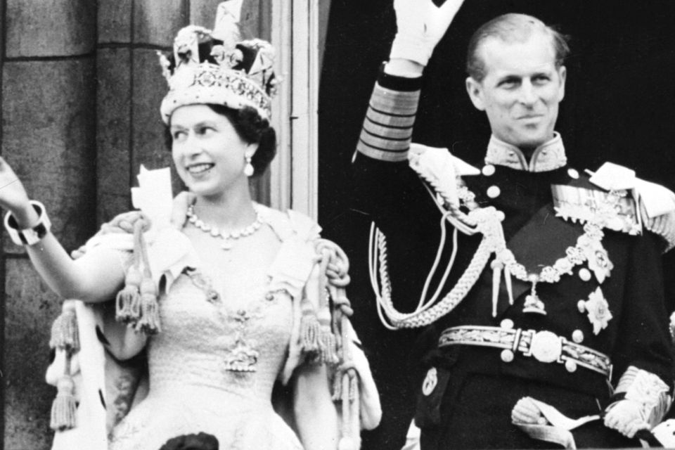 Britain's Queen Elizabeth II (L) accompanied by Britain's Prince Philip, Duke of Edinburgh (R) waves to the crowd, June 2, 1953 after being crowned  at Westminter Abbey in London. - Elizabeth married the Duke of Edinburgh on the 20th of November 1947 and was proclaimed Queen in 1952 at age 25. Her coronation was the first worldwide televised event. (Photo by - / INTERCONTINENTALE / AFP)