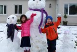 thumbnail: Twins Misha and Cian Chun enjoying the snow in Loughrea, Co Galway, yesterday. Photo: Hany Marzouk