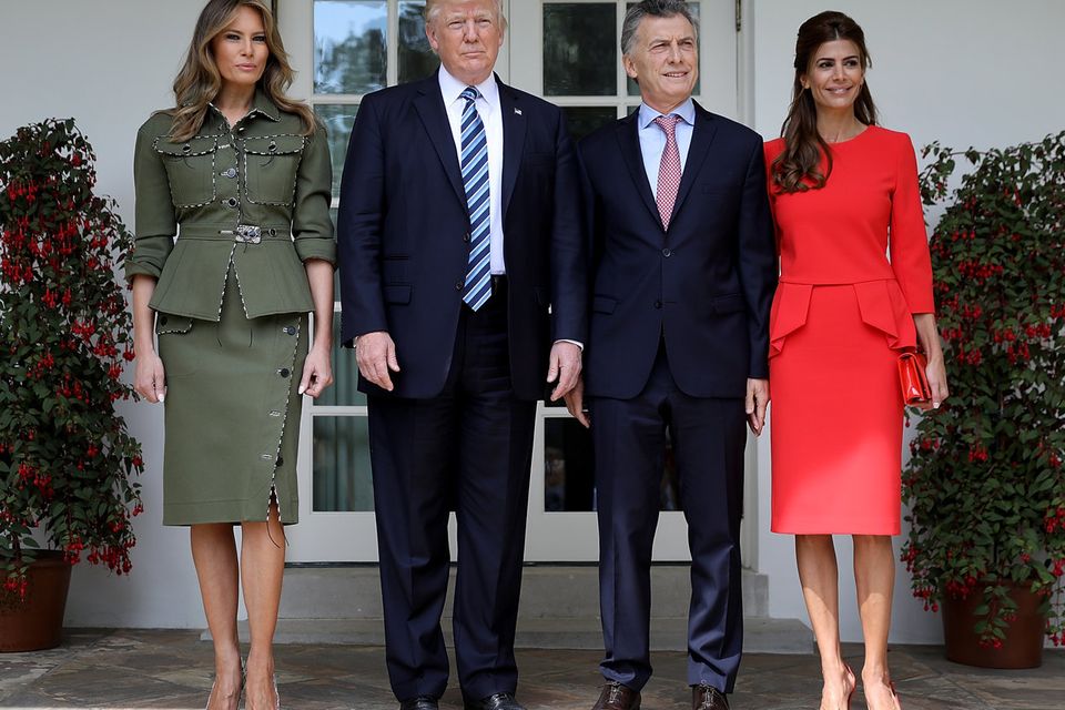 U.S. President Donald Trump and first lady Melania Trump (L) welcome President Mauricio Macri of Argentina and the first lady of Argentina, Juliana Awada (R), to the White House shortly before meeting in the Oval Office April 27, 2017 in Washington, DC