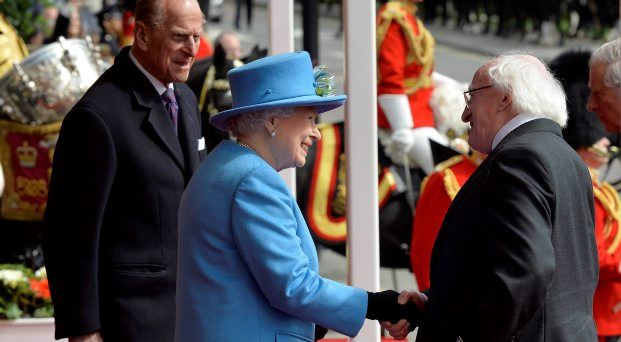 President Higgins is greeted by Queen Elizabeth and Prince Philip outside Windsor Castle