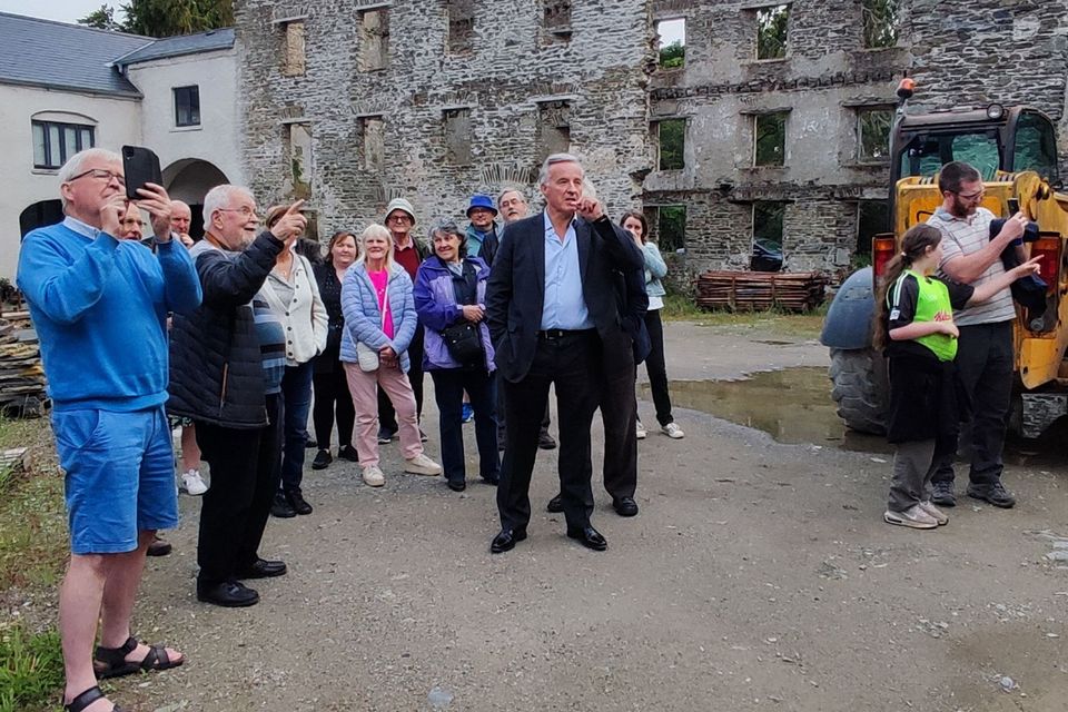 West Wicklow Historical Society members on their Evening Stroll recently in Ballymore Eustace, led by CJ Darby of the Ballymore Eustace Historical Society. The next member's-only Evening Stroll takes place this coming Saturday, July 22 in the village of Ballitore.