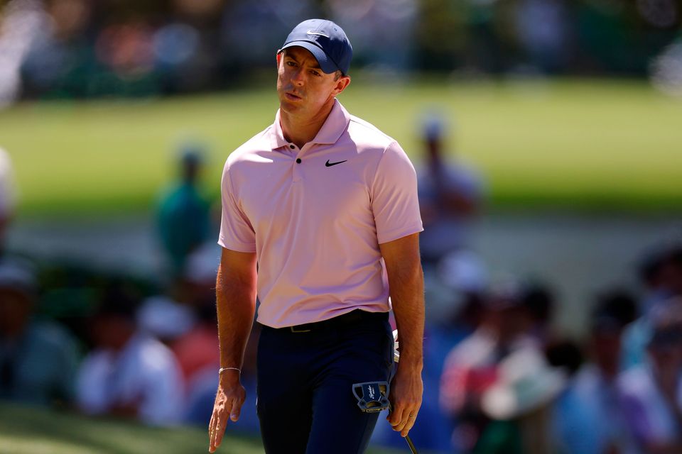 Rory McIlroy reacts after missing a putt on the sixth green