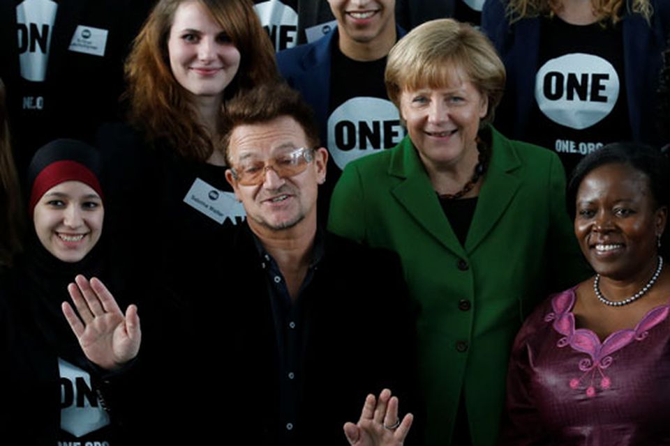 Bono with German Chancellor Angela Merkel and youth representatives of the ONE campaign in Berlin