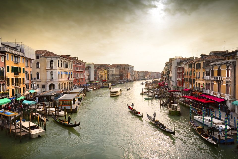 Boats and gondolas on the Grand Canal, Venice, Italy.