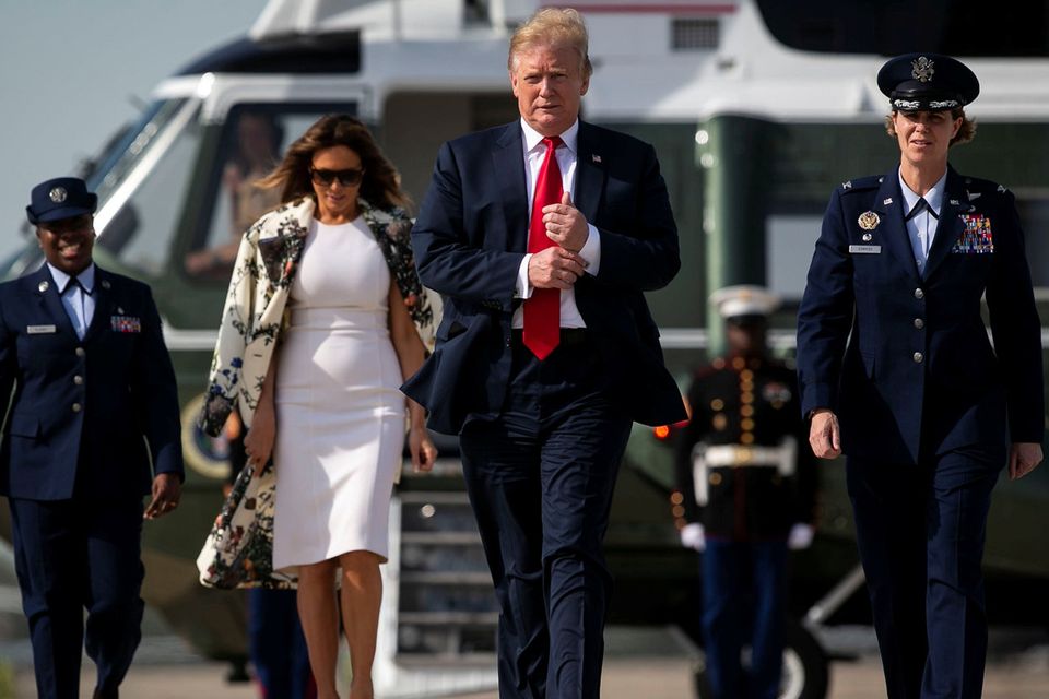 Departure: Donald Trump and First Lady Melania walk towards Air Force One at Joint Base Andrews in Maryland. Photo: Reuters/Al Drago