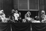 thumbnail: Members of the Royal Family on the balcony following the wedding of Princess Elizabeth and Philip Mountbatten; (L-R) Duke of Kent, Duchess of Kent, Princess Andrew of Greece, Duke of Gloucester holding Prince Richard, Duchess of Gloucester, Queen Elizabeth, Prince William of Gloucester, Prince Michael of Kent, Princess Elizabeth and Queen Mary, at Buckingham Palace, London, November 20th 1947. (Photo by Hulton Archive/Getty Images)