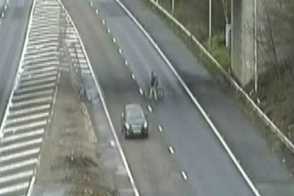 Cyclists occasionally appear on the M25, Britain's busiest motorway. This incident occurred in February this year (Surrey Police/PA Wire)