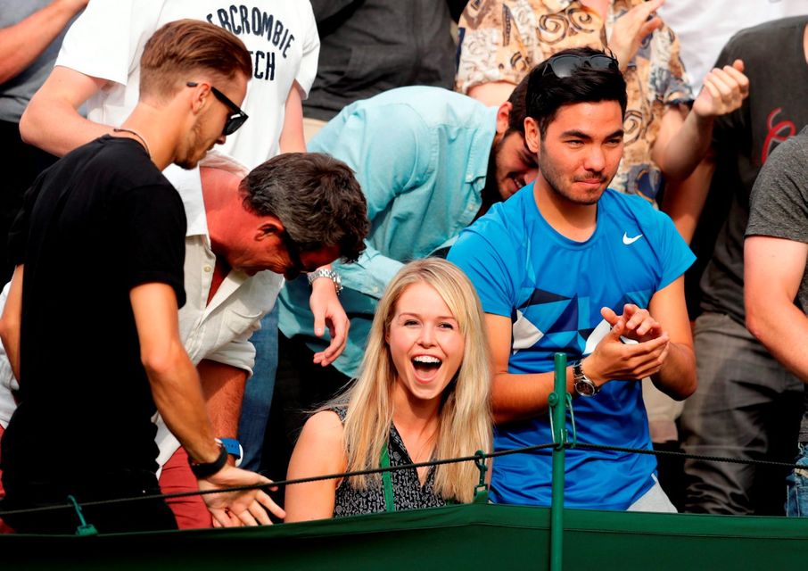 Marcus Willis' girlfriend Jenny Bate celebrates his victory over Ricardas Berankis on day One of the Wimbledon Championships
