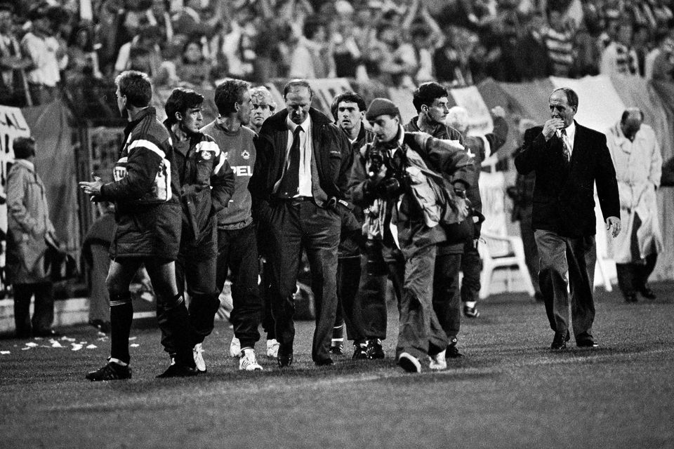 16 October 1991; Republic of Ireland manager Jack Charlton leaves the pitch after the game surrounded by substitutes and backroom staff. UEFA Euro 1992 qualifying Group 7 match, Poland v Republic of Ireland, Stadion Miejski, Poznan, Poland (Ray McManus / SPORTSFILE)