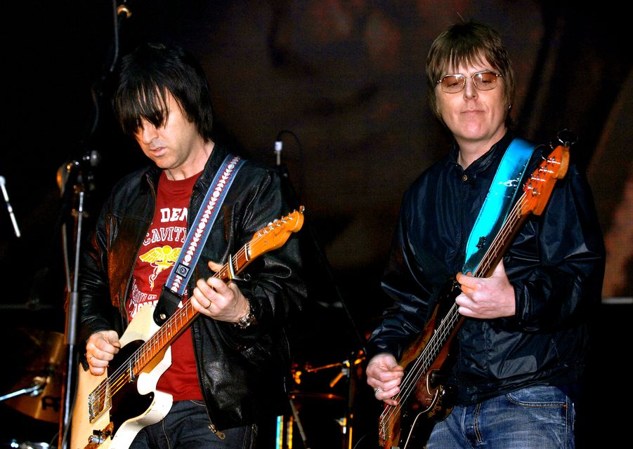 Former members of The Smiths, Andy Rourke (right) and Johnny Marr, on stage (Steve Parsons/PA)