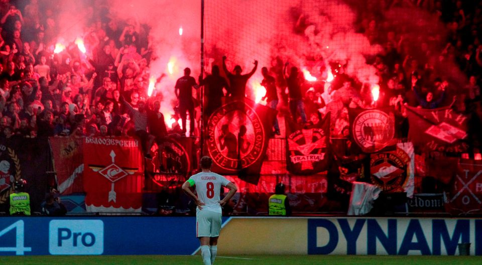 Spartak fans set off fireworks and throw missiles during the Champions League match against NK Maribor. Photo: Srdjan Zivulovic/Reuters