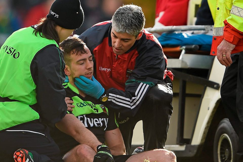 Mayo’s Evan Regan is tended to after a heavy fall against Kerry. Regan was taken off with a ‘blood injury’ due to a cut lip