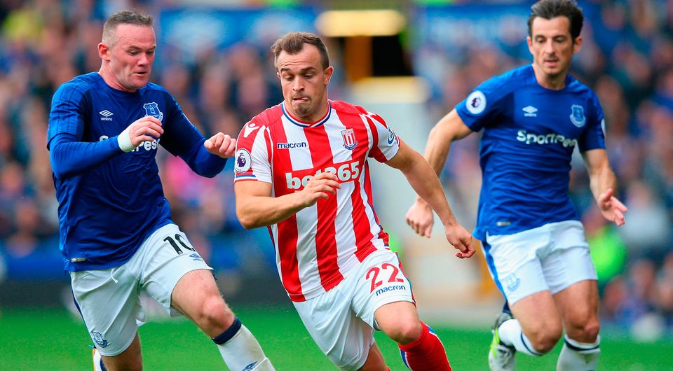Xherdn Shaqiri of Stoke City attempts to get away from Wayne Rooney of Everton    Photo: Getty