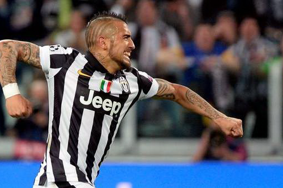 Juventus' Arturo Vidal celebrates after scoring his side's first goal during the Champions League, quarterfinal, first leg soccer match between Juventus and Monaco.