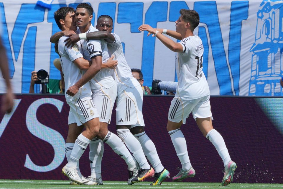 Real Madrid's Jude Bellingham, centre, is congratulated after scoring his side's first goal against Pachuca during the Club World Cup Group H match in Charlotte