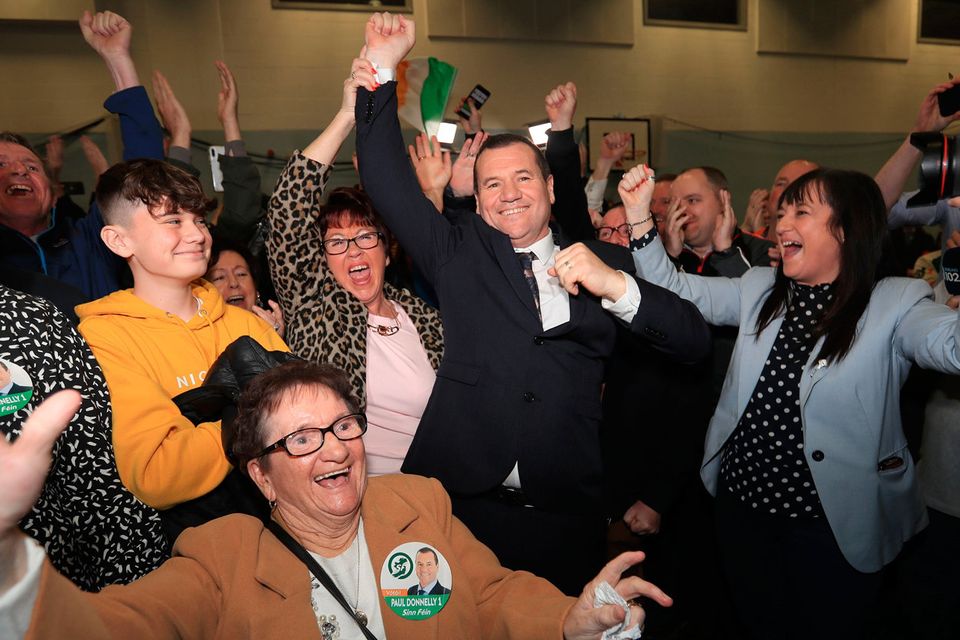 Success: Sinn Féin’s Paul Donnelly celebrates with his mother Bridie (front centre) after topping the poll in Dublin West. Photo: Donall Farmer/Getty Images