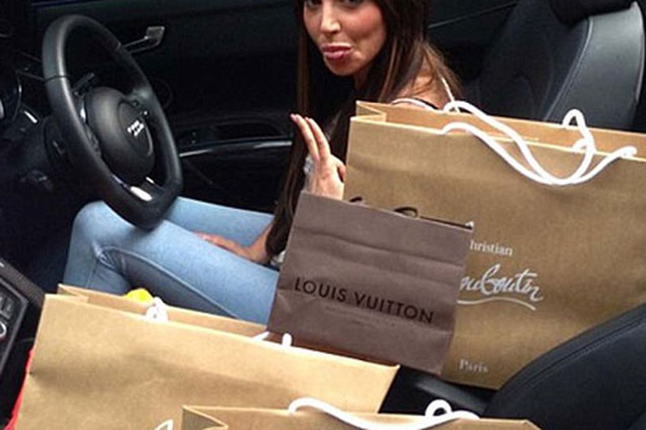 Tulisa celebrates her new look with a shoe shopping spree