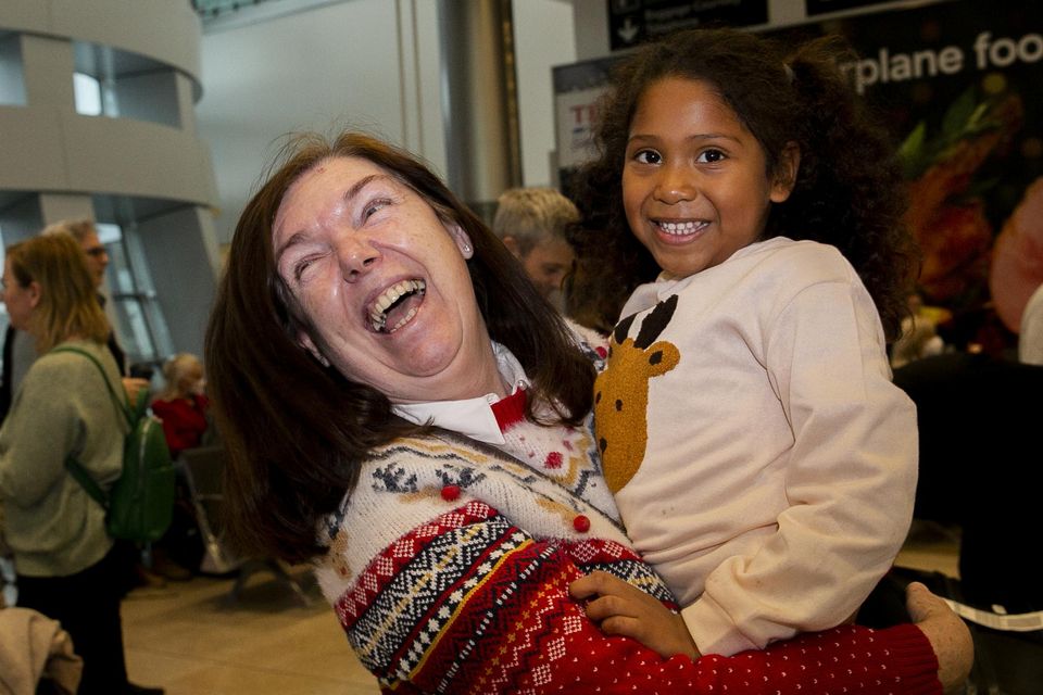 Liz Lavery from Edenderry, Co Offaly greets her granddaughter Ellie King (5) from Bermuda during Christmas homecoming scenes at Dublin Airport. Photo: Gareth Chaney/ Collins Photos