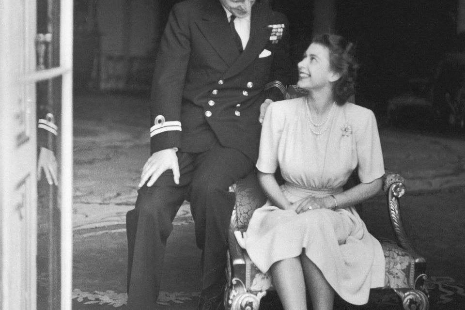 Princess Elizabeth (later Queen Elizabeth II) and her fiance, Philip Mountbatten at Buckingham Palace, after their engagement was announced, 10th July 1947. (Photo by Topical Press Agency/Hulton Archive/Getty Images)