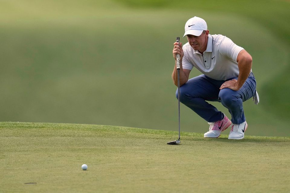 Rory McIlroy lines up a putt on the seventh hole during the third round at The Masters in Augusta, Ga. (AP Photo/David J. Phillip)