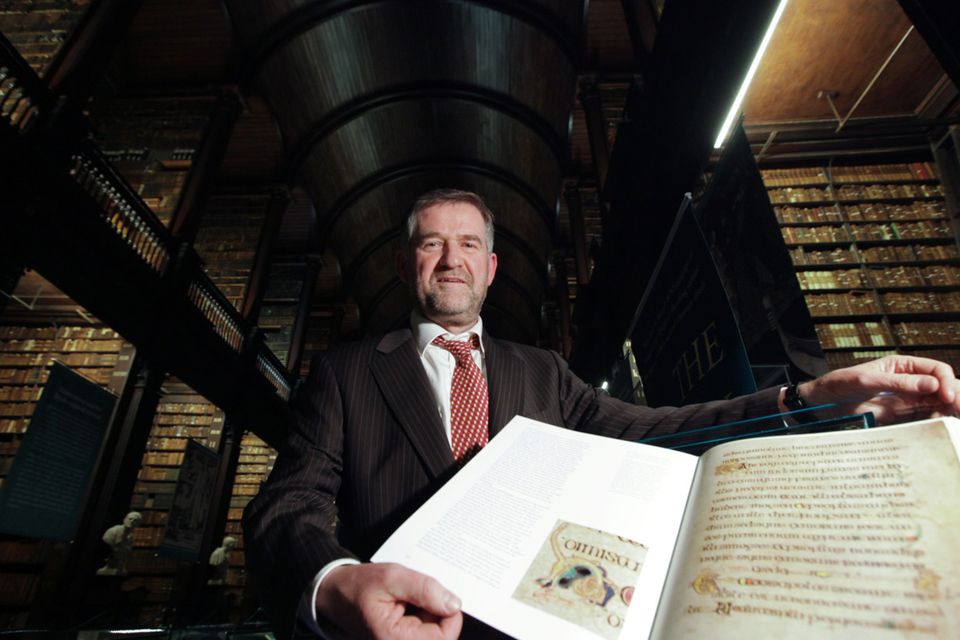 National treasure: Dr Bernard Meehan, the Keeper of Manuscripts at Trinity College Library with a copy of the Book of Kells