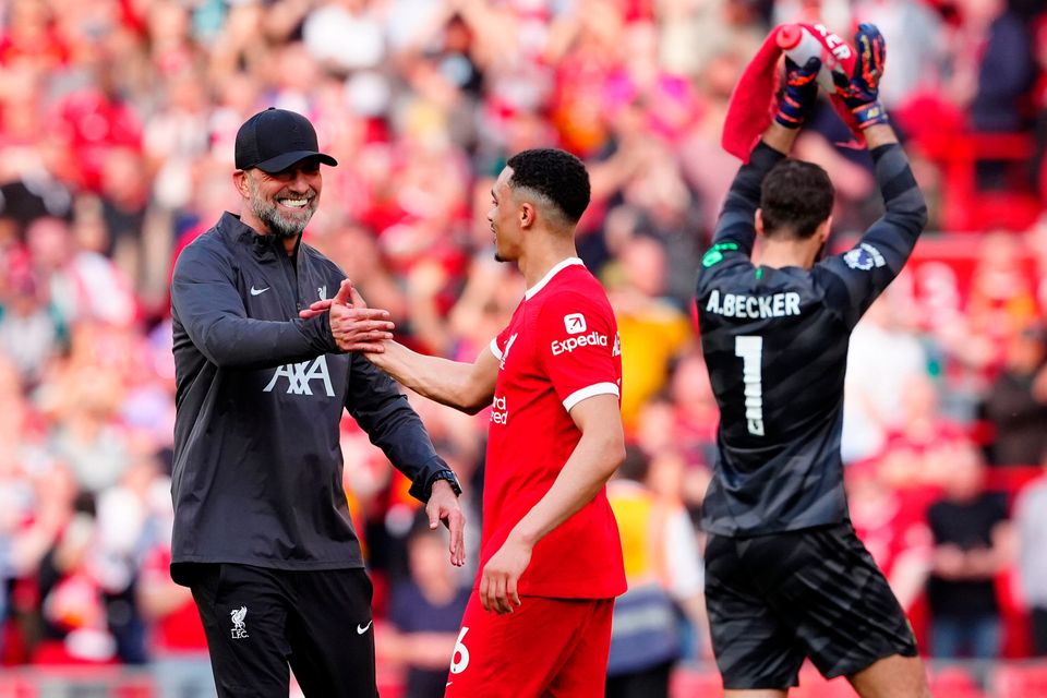 Liverpool manager Jurgen Klopp congratulates Trent Alexander-Arnold (centre) after their 4-2 win over Tottenham at Anfield. Photo: Peter Byrne/PA Wire.