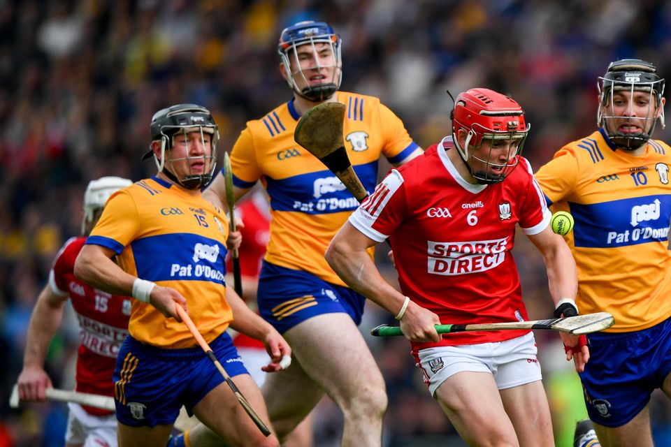 Cork's Ciaran Joyce is pursued by Clare players during their Munster Championship clash. Photo: Ray McManus/Sportsfile
