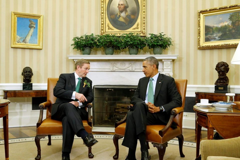 U.S. President Barack Obama (R) speaks with Ireland's Prime Minister Enda Kenny in the Oval Office during a St. Patrick's Day visit at the White House in Washington March 17, 2015. REUTERS/Jonathan Ernst
