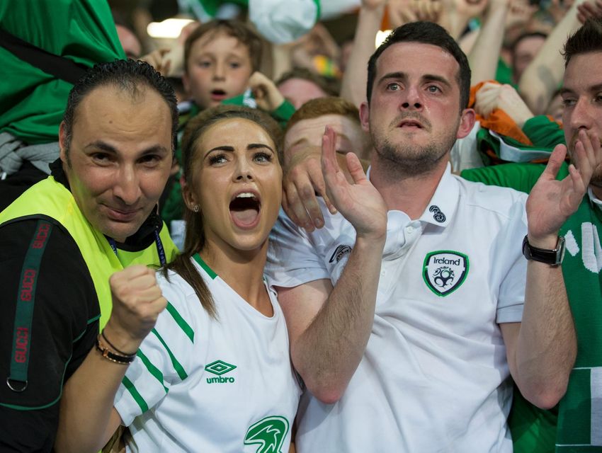 Republic of Ireland Robbie Brady's girlfriend Kerrie Harris (left) and brother (centre) show their emotions at full time of the UEFA Euro 2016 Group E match between Italy and Republic of Ireland at Stade Pierre-Mauroy on June 22 in Lille, France.  (Photo by Craig Mercer/CameraSport via Getty Images)