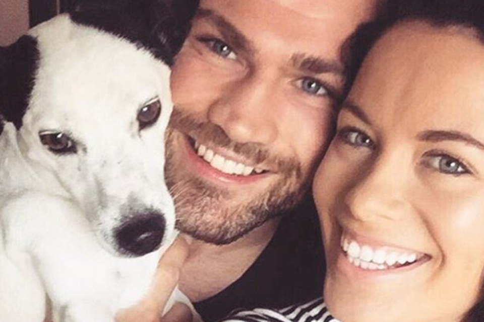 Michelle McGrath and MMA star Cathal Pendred pictured with their dog Ringo. Instagram