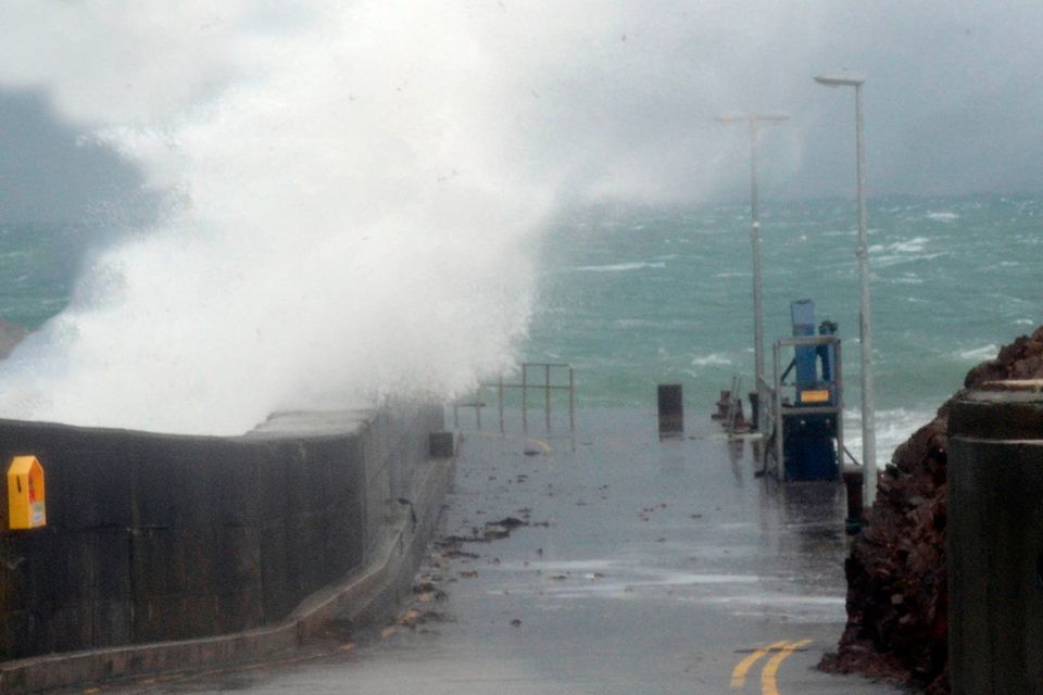 Turbulent: High winds smash the sea into Roonagh Pier, near Westport, Mayo, yesterday. Storms are also likely towards the end of the week, say forecasters. Photo: Paul Mealey