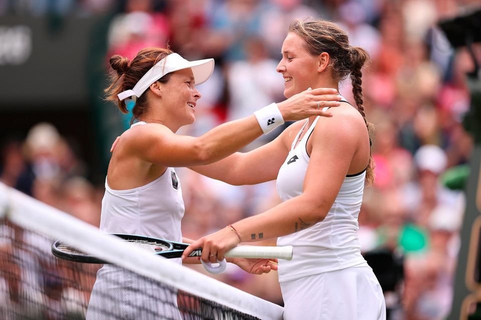 Tatjana Maria of Germany (L) interacts with Jule Niemeier of Germany after winning their Women's Singles Quarter Final match on day nine of The Championships Wimbledon 2022 at All England Lawn Tennis and Croquet Club on July 05, 2022 in London, England. (Photo by Ryan Pierse/Getty Images)