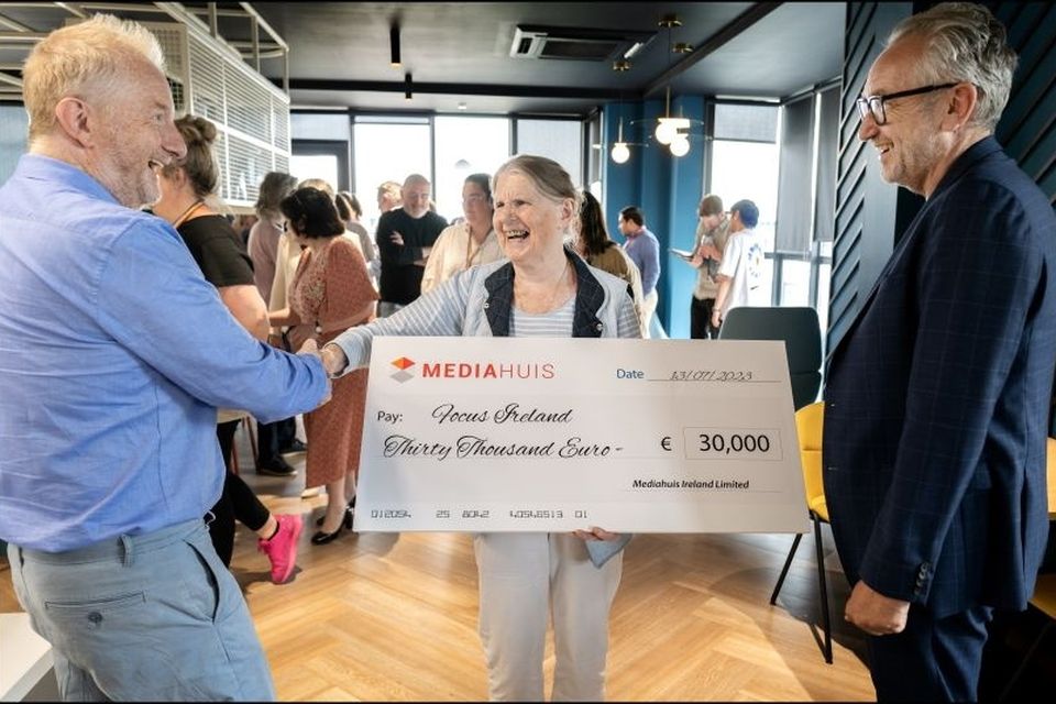 Sister Stanislaus ''Stan'' Kennedy of Focus Ireland receiving a cheque for 30,000 euro which is the proceeds of the Mediahuis Rock Against Homelessness concert held in the 3Olympia last May from Barry Egan and Peter Vandermeersch CEO of Mediahuis Ireland. Photo: David Conachy.