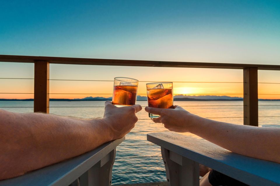 Undated Handout Photo of a couple toasting sunset at sea. See PA Feature TRAVEL Cruise. Picture credit should read: PA Photo/Alamy. WARNING: This picture must only be used to accompany PA Feature TRAVEL Cruise.