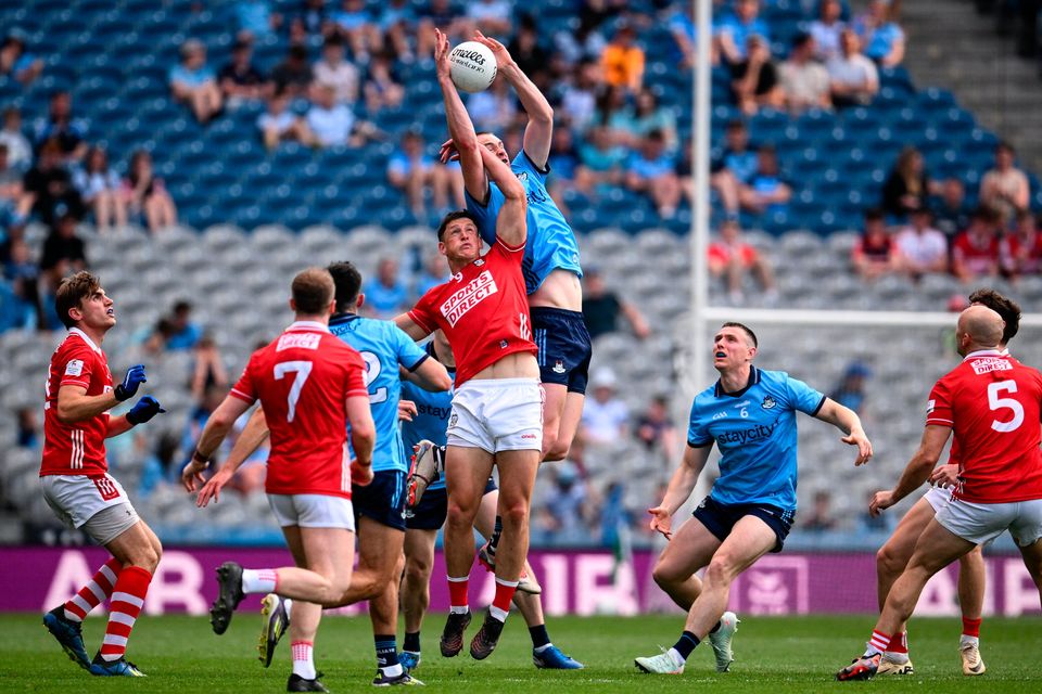 Peadar Ó Cofaigh Byrne of Dublin and Colm O'Callaghan of Cork during the All-Ireland SFC preliminary quarter-final match at Croke Park in Dublin. Photo: Ramsey Cardy/Sportsfile