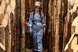 thumbnail: A festival-goer walks among the logs during day one of Glastonbury Festival at Worthy Farm, Pilton on June 26, 2019 in Glastonbury, England.  (Photo by Leon Neal/Getty Images)