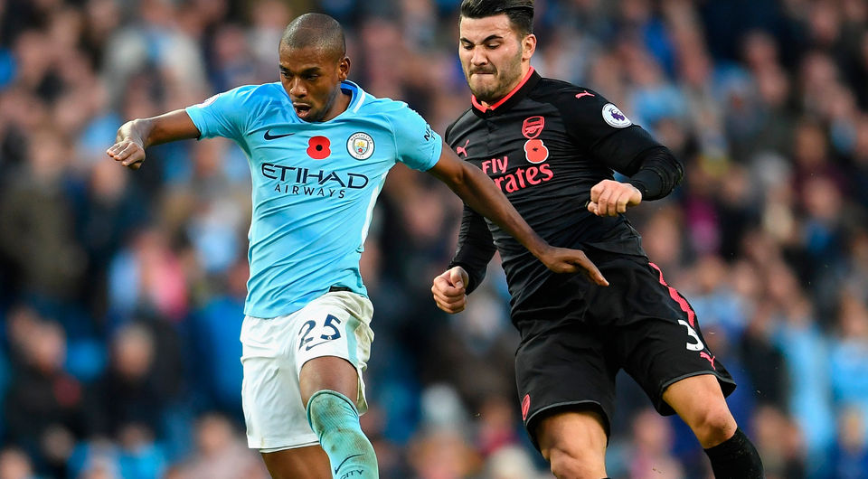 Fernandinho of Manchester City and Sead Kolasinac of Arsenal battle for possession. Photo: Getty Images