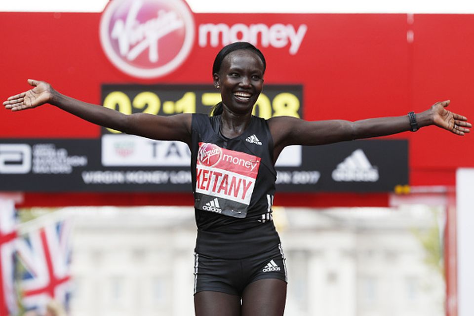 Kenya's Mary Keitany celebrates after winning the women's elite race at the London marathon on April 23, 2017 in London.
Kenya's Mary Keitany won a third London Marathon today posting an unofficial time of 2hrs 17min 01sec -- the fastest time in a women-only marathon. / AFP PHOTO / Adrian DENNIS