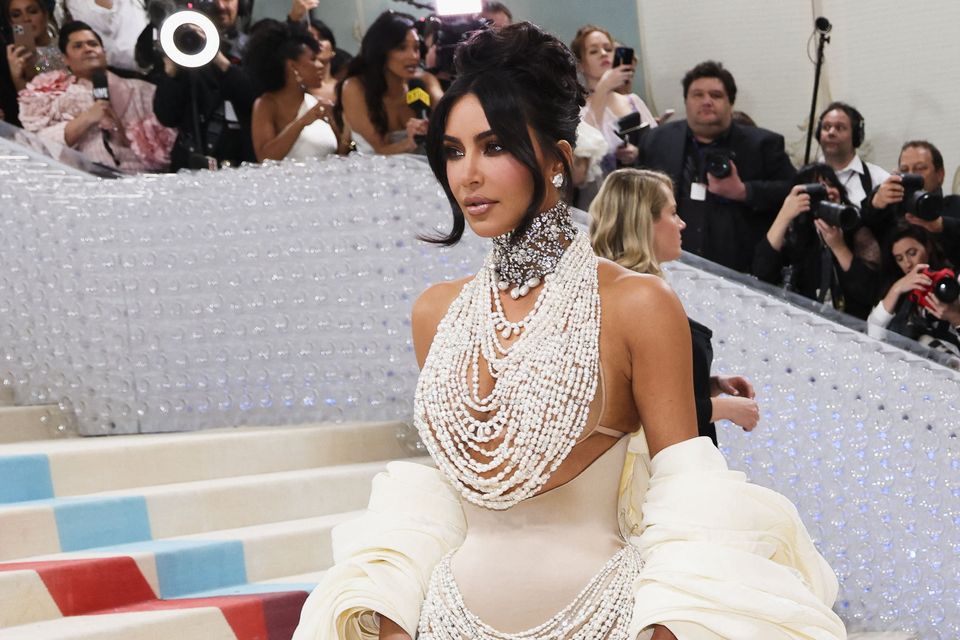 Kim Kardashian poses at the Met Gala, an annual fundraising gala held for the benefit of the Metropolitan Museum of Art's Costume Institute with this year's theme "Karl Lagerfeld: A Line of Beauty", in New York City, New York, U.S., May 1, 2023. REUTERS/Andrew Kelly